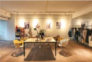 Right Suntone design showroom with clothing racks and sample table